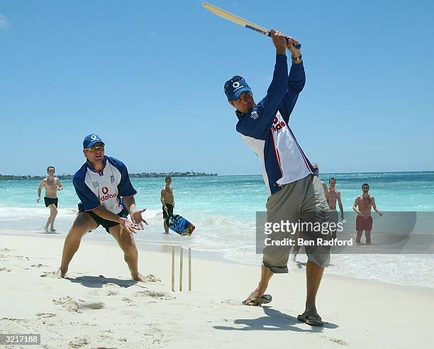 England Captain Michael Vaughan hits out as Matthew Hoggard keeps wicket during a game of beach cricket after winning the third Cable and Wireless...