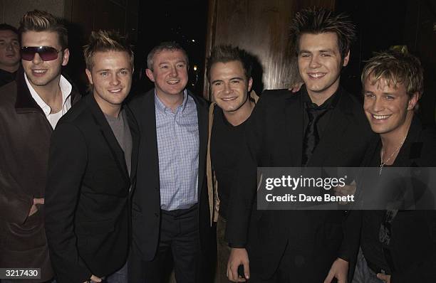 Westlife with their manager, Louis Walsh during the party that boy-band 'Westlife' threw to celebrate reaching number one in the charts and hail the...