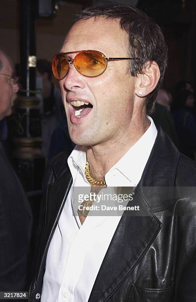 Writer A.A. Gill during the street party and collection preview in Saville Row on 12th February 2002 to mark the new couture headquarters of designer...