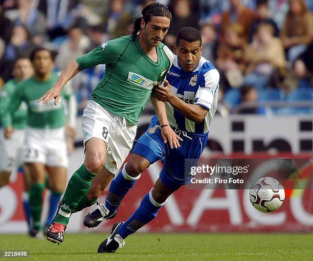 Mauro Silva of Deportivo challenges Julio Cesar Arzu of Betis during the Spanish Primera Liga match between Deportivo de La Coruna and Betis at...