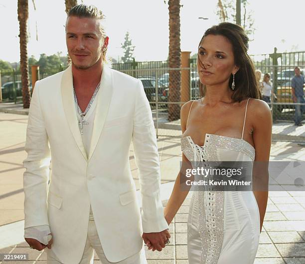 David and Victoria Beckham attend The 2003 MTV Movie Awards held at the Shrine Auditorium on May 31, 2003 in Los Angeles, California. David Beckham...