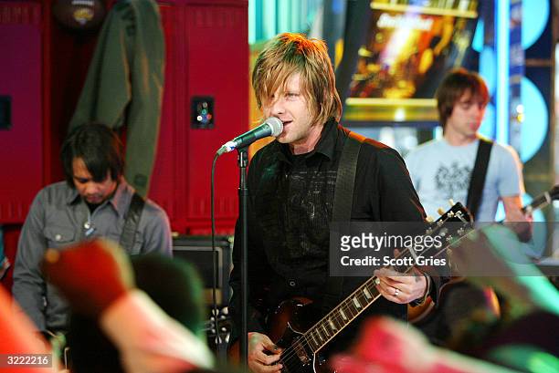 Switchfoot lead singer Jon Foreman performs as he appears on stage during MTV's High School Week on Total Request Live at the MTV Times Square...