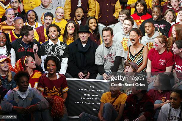 Actors Bruce Willis and Matthew Perry sit with students as they appear on MTV's High School Week on Total Request Live at the MTV Times Square...