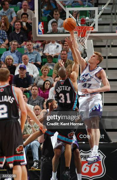 Andrei Kirilenko of the Utah Jazz blocks the shot of Shane Battier of the Memphis Grizzlies on April 5, 2004 at the Delta Center in Salt Lake City,...