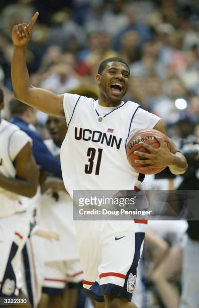 Rashad Anderson of the UConn Huskies celebrates after defeating the Georgia Tech Yellow Jackets 82-73 during the National Championship game of the...