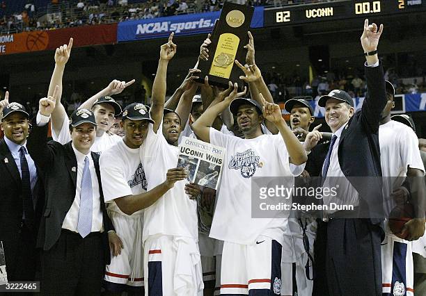 The UConn Huskies celebrate with the trophy after defeating the Georgia Tech Yellow Jackets 82-73 during the National Championship game of the NCAA...