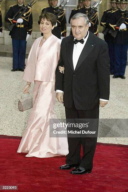 French Prime Minister Jean-Pierre Raffarin arrives with his wife Anne-Marie at the Elysee Palace for a state banquet hosted by French President...