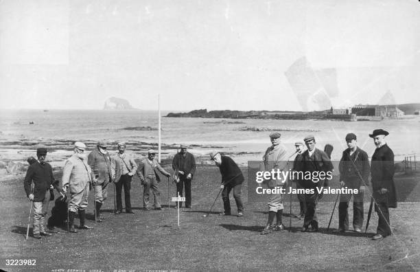 Golfers putting out on the links at North Berwick, East Lothian.