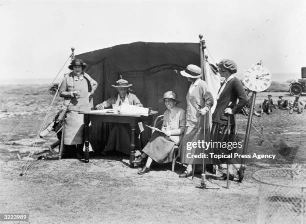 From left to right, Mrs W A Gavin, Miss MacFarlane, Mrs Judge and Mrs Doris Park take part in the Ladies Golf Championship at Sandwich, Kent.