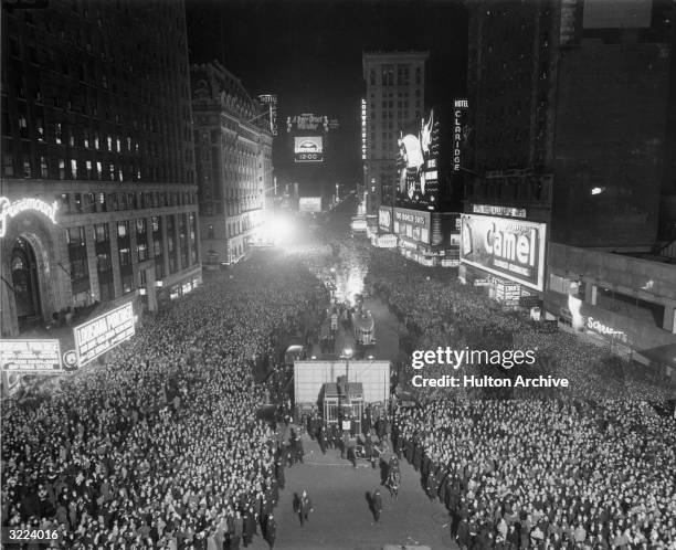 High-angle view of crowds gathering at midnight in Times Square for the ball dropping on New Year's Eve, New York City.