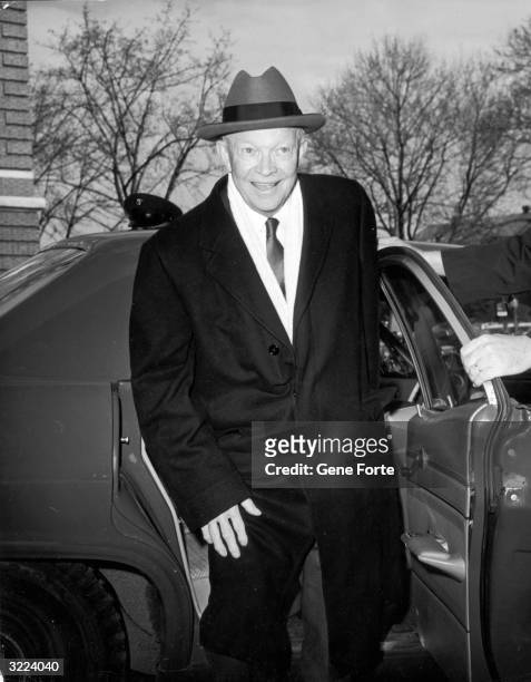 Former president Dwight D. Eisenhower arrives at Walter Reed Hospital to have an operation performed on his gall bladder, Washington, DC.