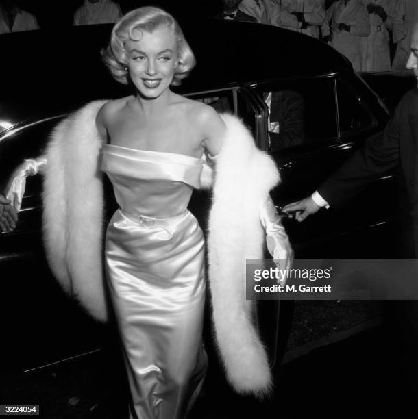 Marilyn Monroe arriving at the premiere of the film 'There's No Business like Show Business'.