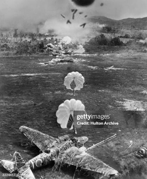 Bombing Rampage Parachute bombs about to land and explode on a Japanese plane,... News ...