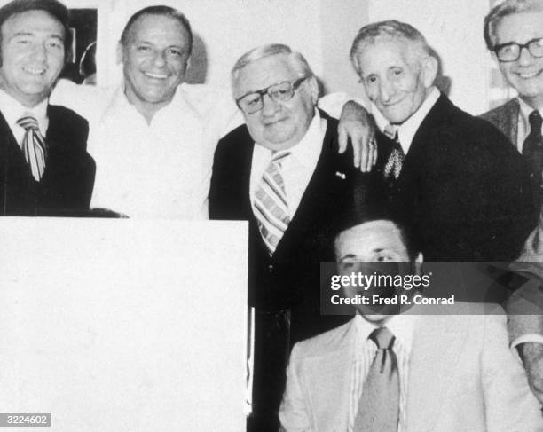 American actor and singer Frank Sinatra posing with a group of reputed mobsters at a Westchester theater, New York. L-R: Gregory DePalma, Sinatra,...