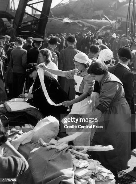 Nurses help the wounded during the aftermath of a triple train crash at Harrow and Wealdstone station. It is feared that the death toll could reach...