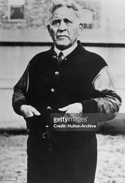 American football coach Amos Alonzo Stagg poses with his hands in the pockets of his varsity jacket, University of Chicago, Illinois. Stagg played or...