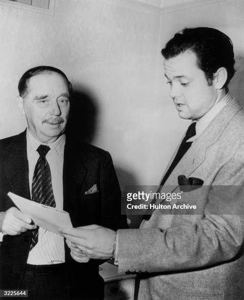 American actor, director and producer Orson Welles with British author H G Wells following Welles' radio dramatization of Wells' book, 'The War of...