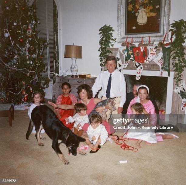 President John F. Kennedy and First Lady Jacqueline Kennedy pose with their family on Christmas Day at the White House, Washington, D.C., December...