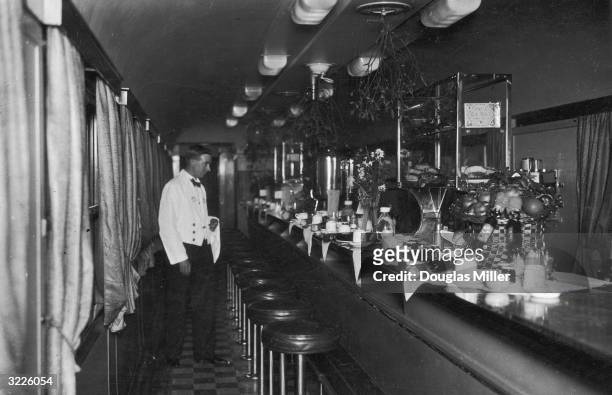Mistletoe and christmas crackers provided for passengers in the buffet car of the GWR Bristol Express.