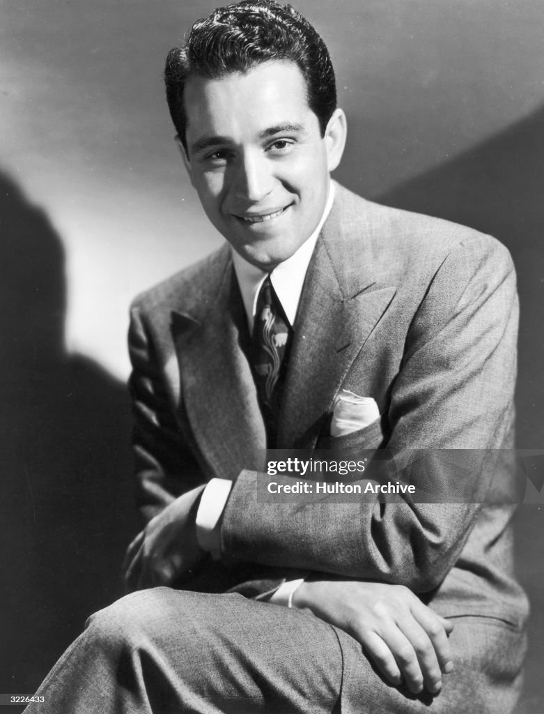 Perry Color Studio portrait of American singer Perry Como wearing a suit and tie ...