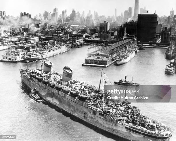 Troop transport ship arriving in New York City after World War I, circa 1919.