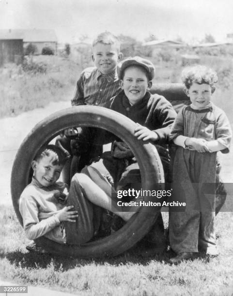 The Nixon brothers pause for a picture during a play session in Yorba Linda, California. Richard, age 9, is standing at left beside Harold and Arthur...