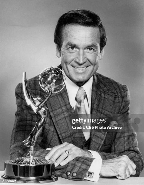 American television personality, game show host, and animal rights activist Bob Barker leans on a counter with an Emmy statuette in a promotional...
