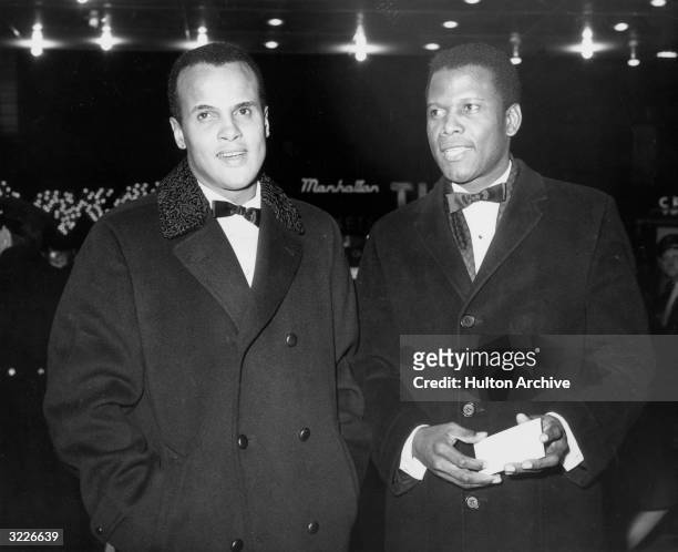 American actor and singer Harry Belafonte with American actor Sidney Poitier at the New York premiere of director George Stevens' film, 'The Greatest...