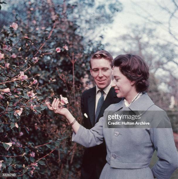 Princess Margaret and Antony Armstrong-Jones in the grounds of Royal Lodge on the day they announced their engagement.