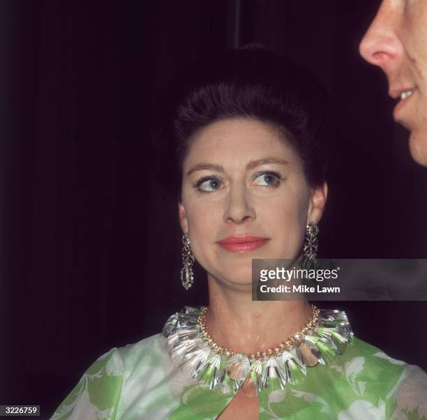 Princess Margaret at the Royal Festival Hall after a Frank Sinatra concert in aid of the NSPCC, she is looking up at her husband Lord Snowdon.