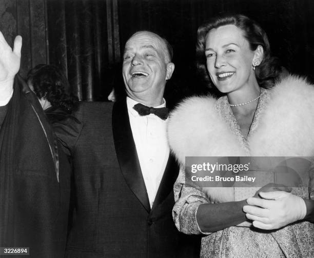 American ventriloquist Edgar Bergen and his wife, actor Frances Bergen, smiling at the premiere of director Daniel Mann's film, 'Teahouse of the...