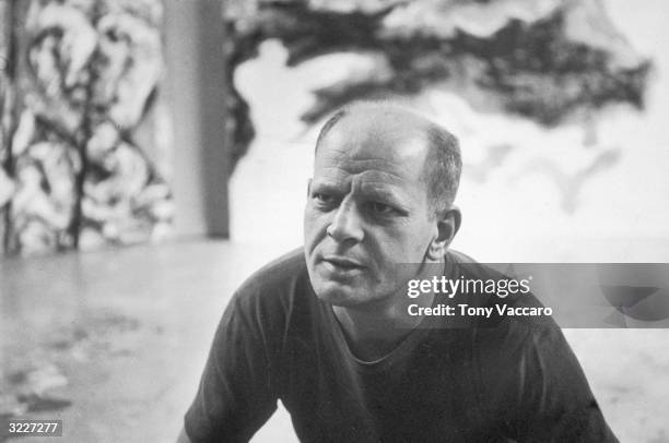 Portrait of American Abstract Expressionist painter Jackson Pollock at his studio in East Hampton, New York.