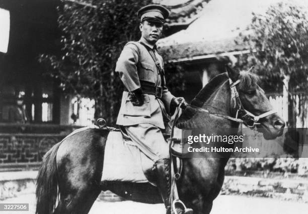 Marshal Chiang Kai-shek , commander in chief of the Chinese army, mounted on his horse, 'Black Dragon,' China.