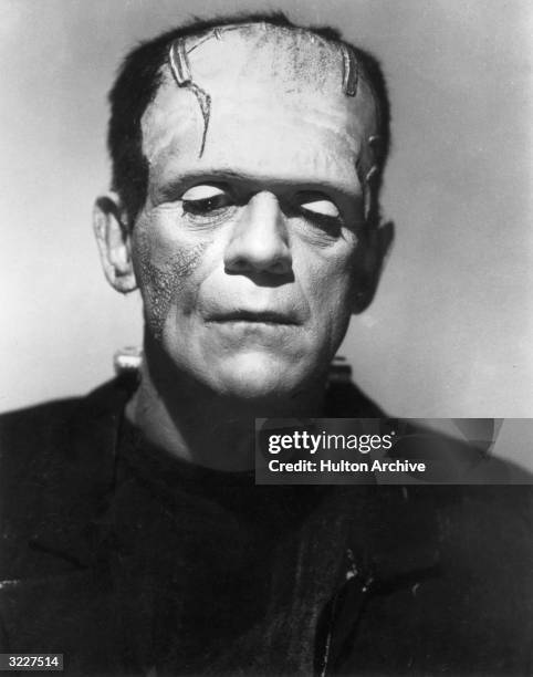 British actor Boris Karloff lowers his eyes as the Monster in a promotional portrait for director James Whale's film, 'Frankenstein'.