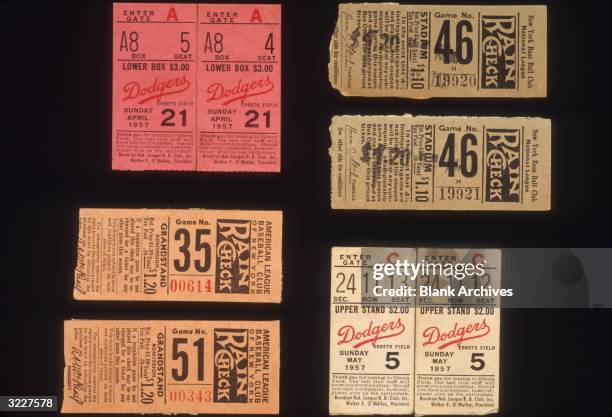 Still-life of an assortment of New York Yankees, Giants and Brooklyn Dodgers ticket stubs.