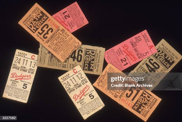 Still-life of an assortment of New York Yankees, Giants and Brooklyn Dodgers ticket stubs.