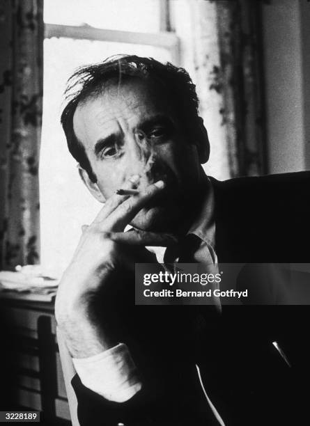 Portrait of Romanian-born writer Elie Wiesel smoking a cigarette.