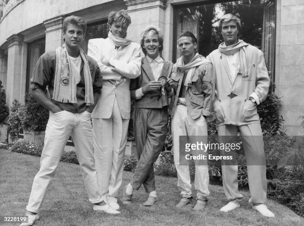 Portrait of British pop group Duran Duran, standing outdoors. Left to right, drummer Roger Taylor, guitarist John Taylor, keyboard player Nick...