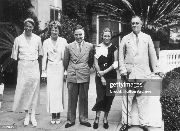 Left to right: first Lady Eleanor Roosevelt, aviator Amelia Earhart , Jim and Amy Mollison and President Roosevelt in Hyde Park, New York. A week...