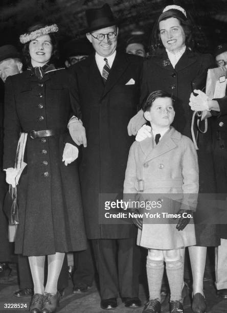 Ambassador to England Joseph P Kennedy stands with three of his children at Paddington Station, London, England. From left to right, Rosemary,...