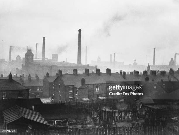 Cotton mill chimneys belching smoke in Manchester.