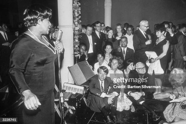 American jazz singer Ella Fitzgerald performing at a party for Senator Robert F Kennedy and his wife, Ethel Kennedy , at the New York Shakespearean...