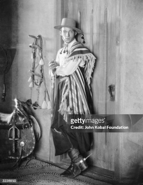 Italian heartthrob Rudolph Valentino wearing a gaucho costume complete with spurs for his famous tango scene as Julio in Rex Ingram's 'Four Horsemen...