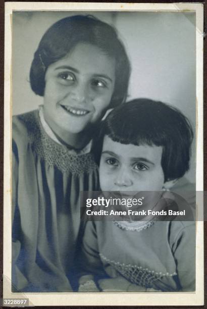 Margot and Anne Frank in a studio portrait. This photo was taken from Margot's photo album, Frankfurt, Germany.