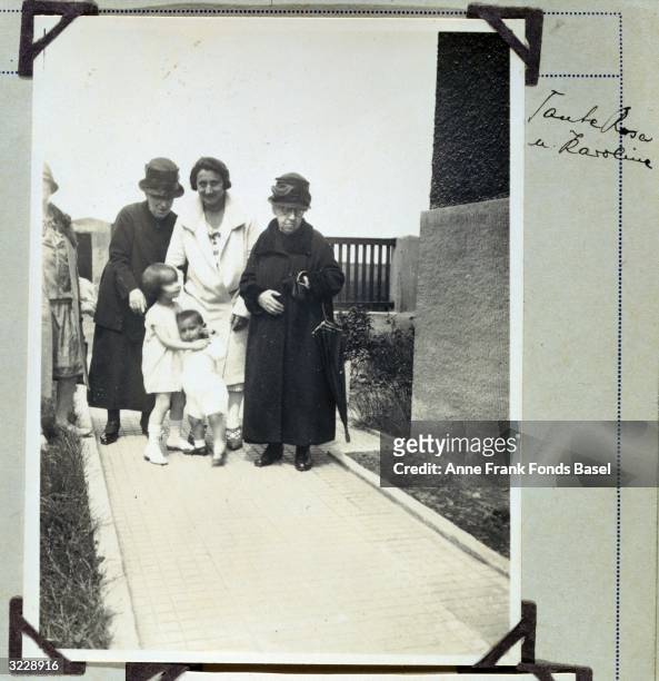 Edith Frank, the mother of Anne Frank, Aunt Rosa, Aunt Karoline, Margot and Janine Schuster walking to their house, taken from Margot's photo album,...