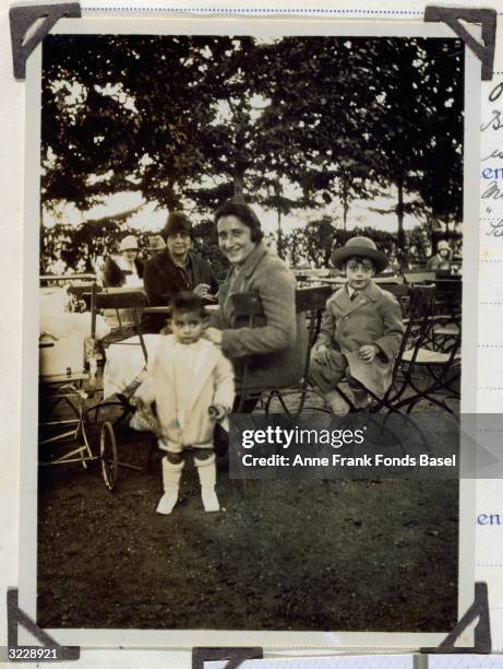 Mother of Anne Frank, Edith Frank-Hollander with her first daughter Margot Frank with mother-in-law, Alice Frank, and Margot's cousin, Stephan Elias,...