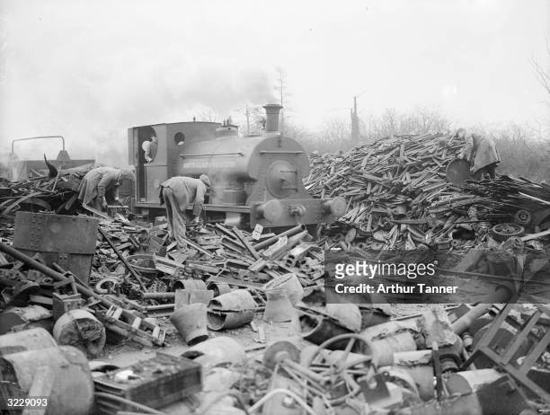 Railway locomotive amongst the scrap at a foundry in Letchworth. The scrap iron will be melted and converted into high quality steel.