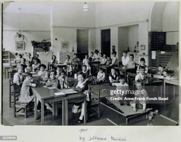 Photo taken from Anne Frank's photo album of Mrs Baldal's class at a montessori school in Amsterdam. Anne Frank is sitting in the corner near the...