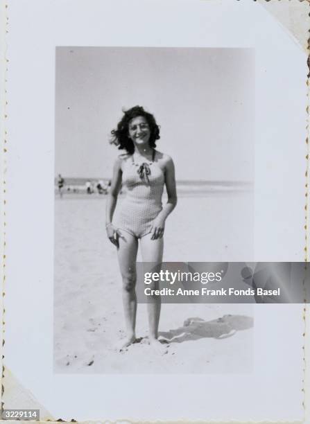 Full-length portrait of Anne Frank's sister Margot Frank wearing a bathing suit on a beach taken from Anne Frank's photo album.