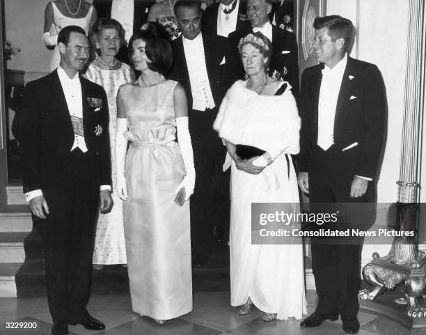 President John F Kennedy and Jacqueline Kennedy pose with the Grand Duchess Charlotte of Luxembourg during a State Dinner in her honor at the White...